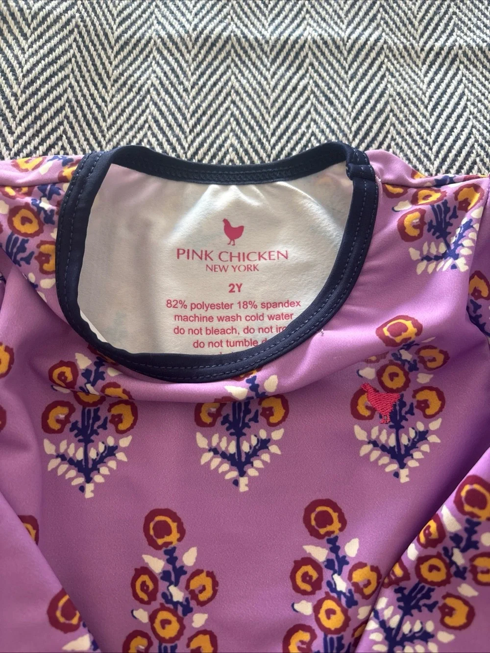 Pink Chicken Purple Floral Rash Guard and Multicolor One-Piece Swimsuit